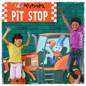 Two kids jumping for joy nets to a painting of a Kubota tractor