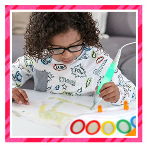 Young kid coloring with color wonder