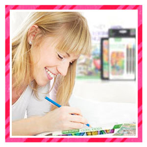 Woman smiling and drawing with colored pencil