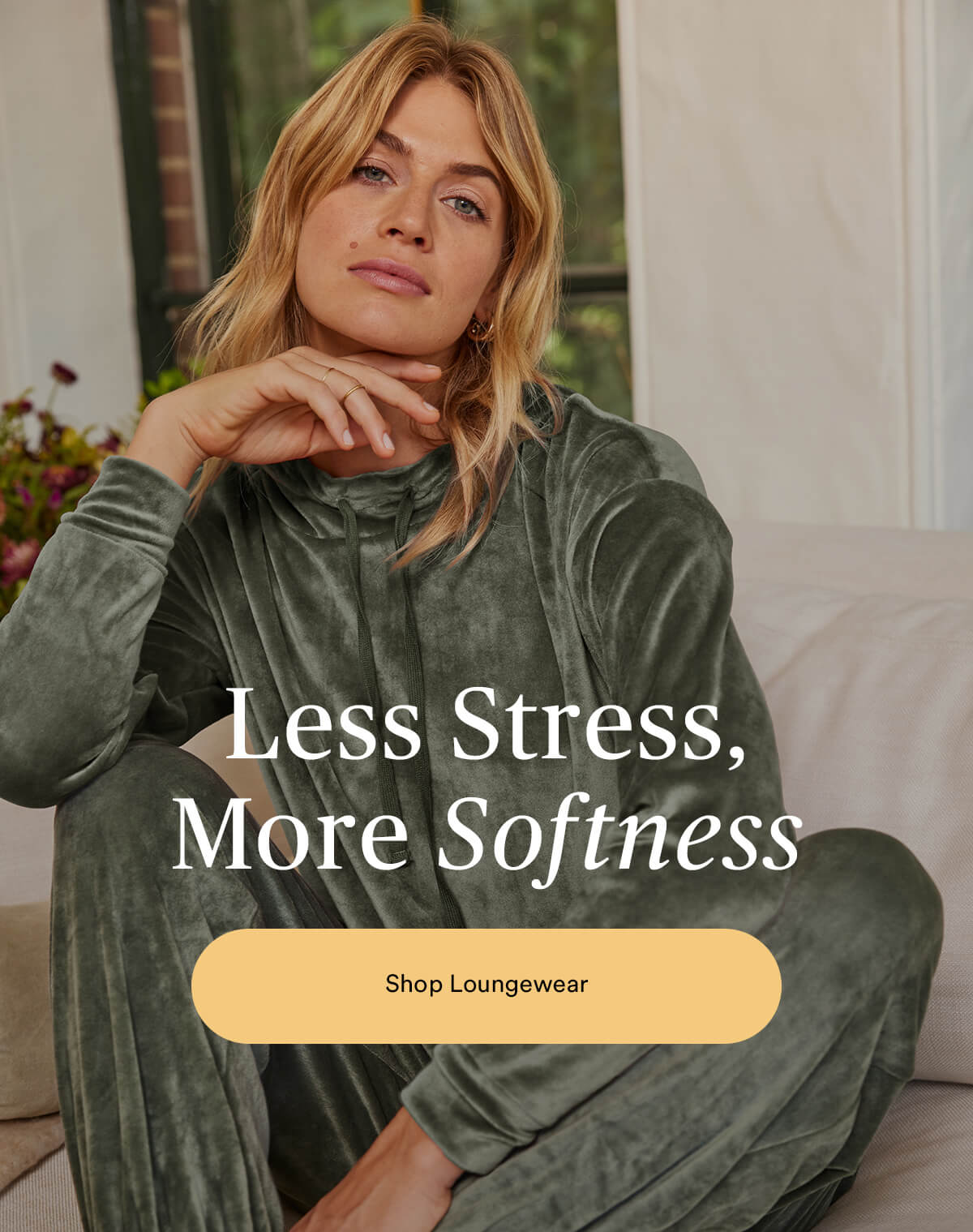 Less stress, more softness. Shop Loungewear. Image of woman wearing The Plush Velour hoodie and pants.