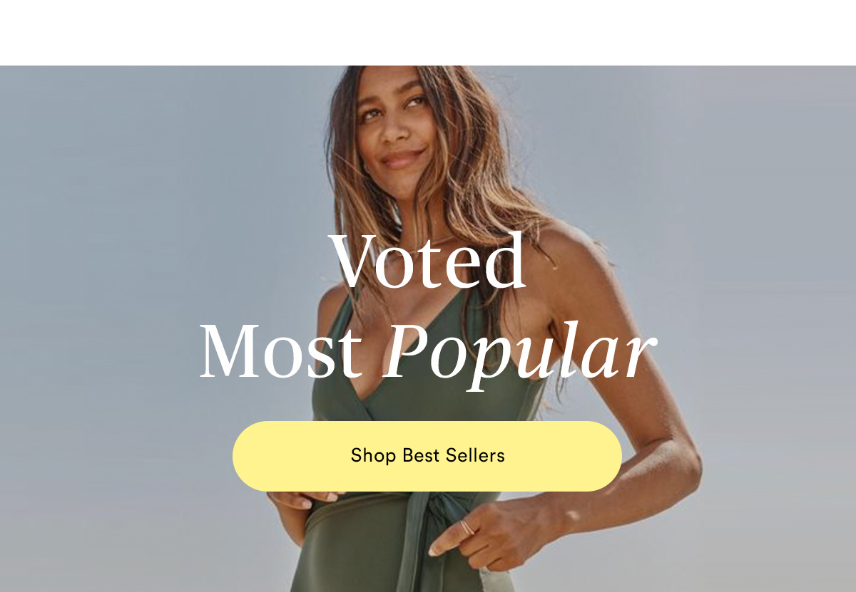 Voted most popular. Lifestyle image of woman wearing The Perfect Wrap One-Piece in Olive.