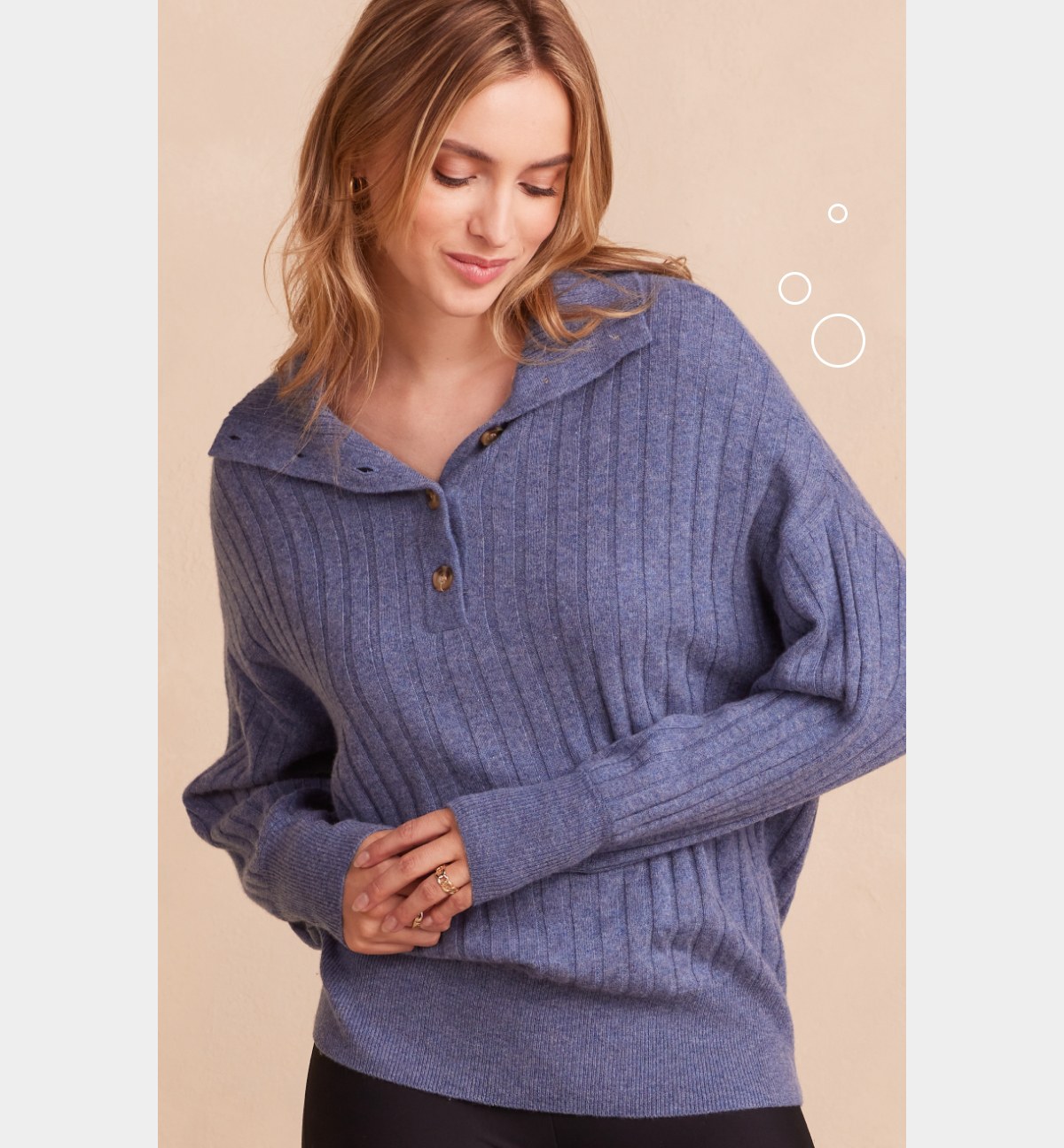 Models wearing blue cashmere ribbed half button sweater