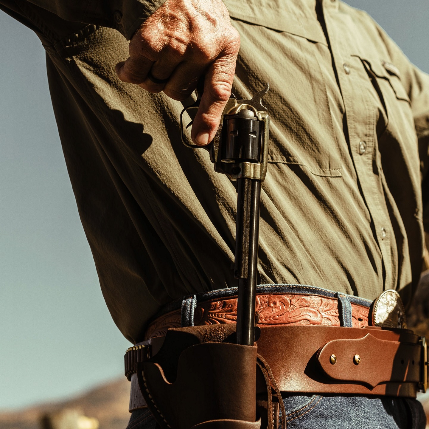 Man holding Heritage revolver