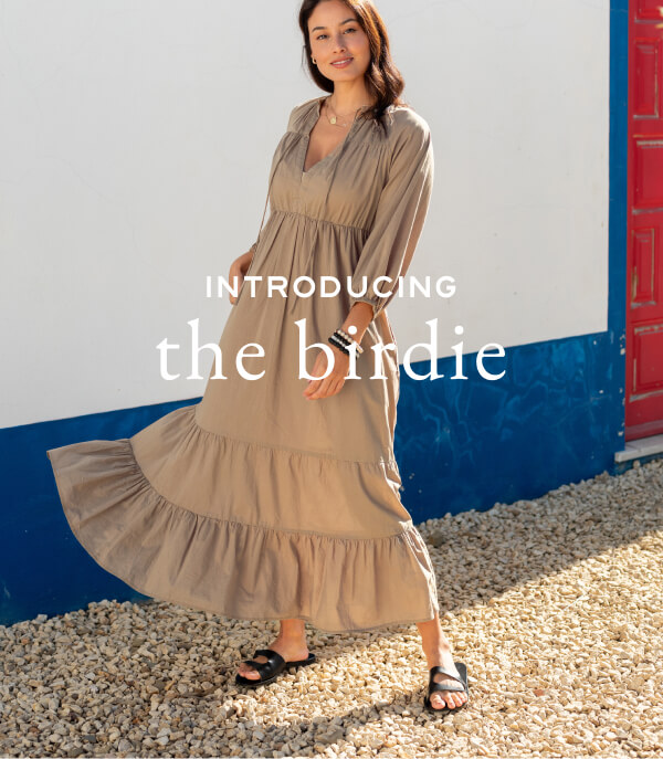 Introducing the Birdie - Image of a woman wearing a brown tiered long sleeve maxi dress