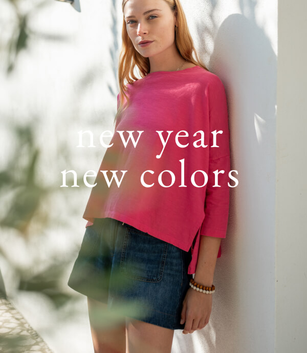 New Year New Colors - Image of a woman wearing a pink long sleeve tee with side slits