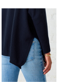 Close up image of side slit and back of navy cashmere sweater