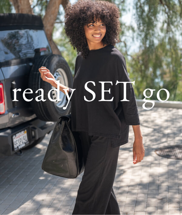 ready SET go - Image of a woman in a matching black long sleeve tee set