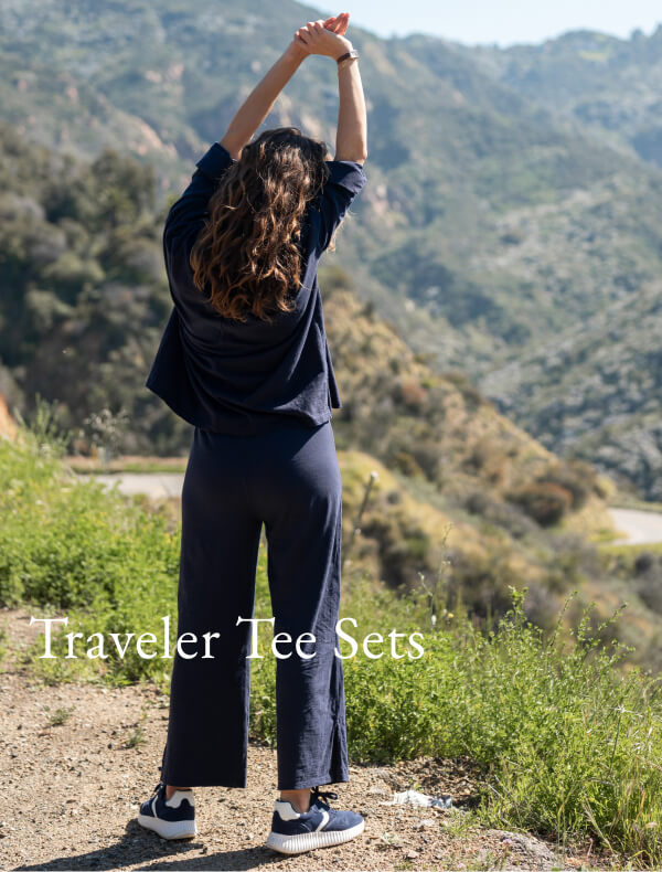 Traveler Tee Sets - Image of a woman wearing a long sleeve navy tee with matching pants