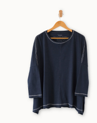 Image of a navy long sleeve tee with white detailing on the trim