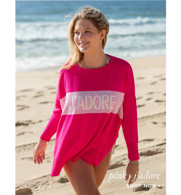 Image of a woman on a beach wearing a pink sweater that says "J'ADORE" - pink-j'adore - Shop now