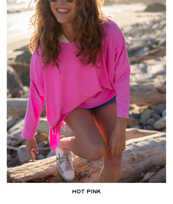 Hot Pink - Woman on beach wearing hot pink tee