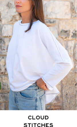 Cloud Stitches - Close up of woman wearing white long sleeve tee with grey stitches