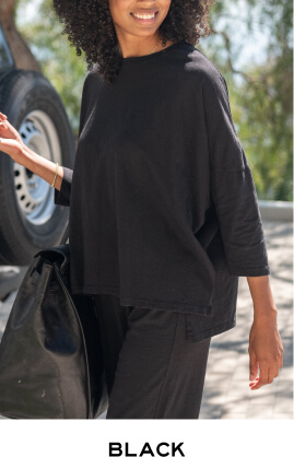 Black - Close up of woman wearing black long sleeve tee