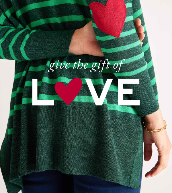 give the gift of love - image of woman wearing green striped sweater with a red heart patch on the elbow