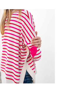 Image of woman wearing white sweater with pink and red stripes and pink heart patches on the elbow