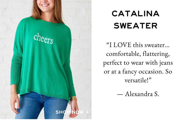 Catalina Sweater - Shop Now - Review from a customer about how comfortable, flattering and versatile the sweater is. - Image of green crewneck sweater with "cheers" on it.