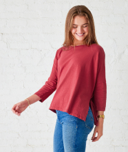 Image of woman in a red long sleeve tee