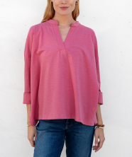 Image of a woman in a pink long sleeve v-neck tee