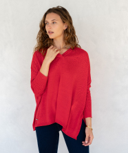 Image of a woman in a red v-neck sweater