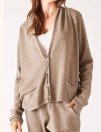 Image of a woman wearing a tan cashmere cardigan