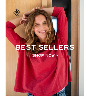 Best Sellers - Shop now - Image of woman wearing a red long sleeve tee