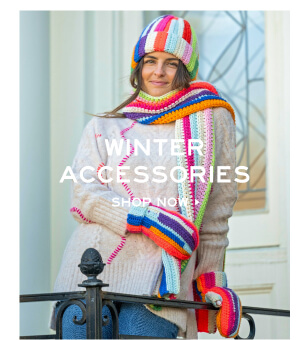 Winter Accessories - Shop now - Image of a woman wearing colorful mittens, scarf and hat