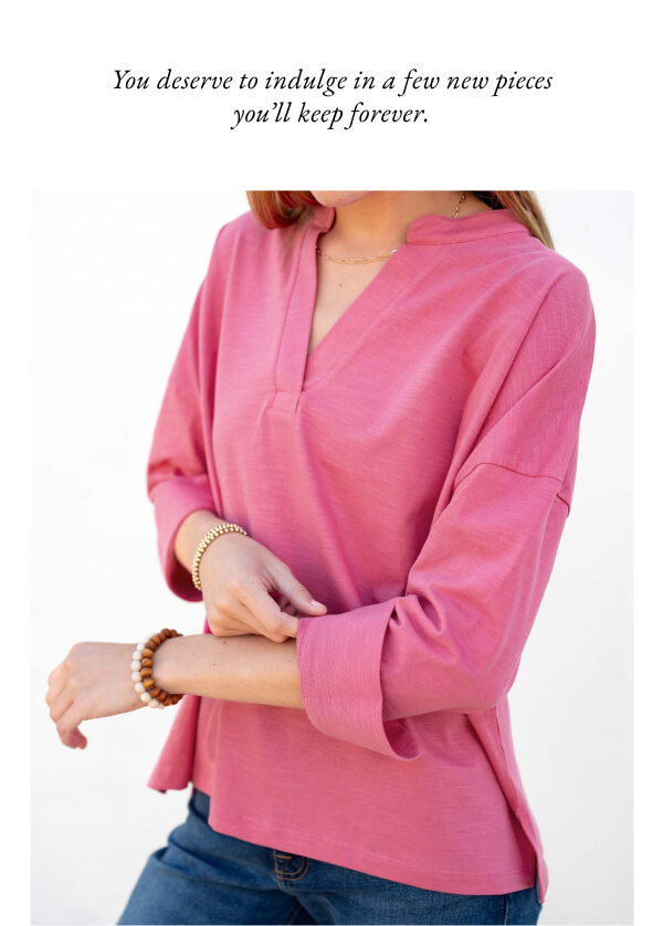 You deserve to indulge in a few new pieces you'll keep forever. - Image of a woman wearing a pink v-neck cuffed tee