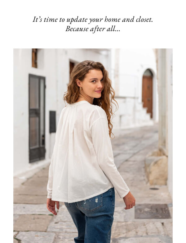 It's time to update your home and closet. Because after all... - Image of a woman wearing a white long sleeve tee walking the streets of italy