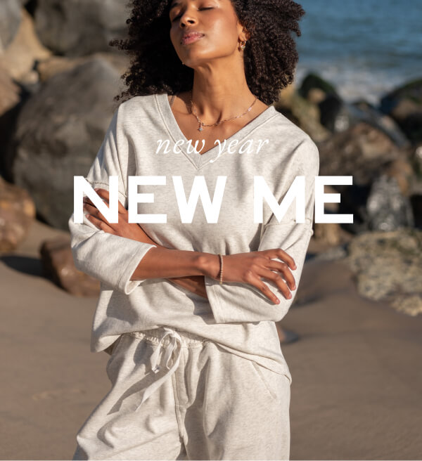 New Year New Me - Image of a woman on the beach wearing a light heather matching set