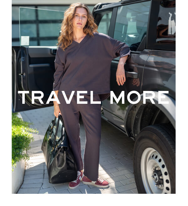 Travel More - Image of a woman wearing a dark gray french terry set