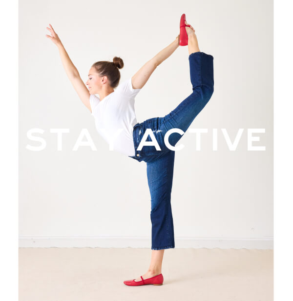 Stay Active - Image of a woman stretching wearing blue jeans