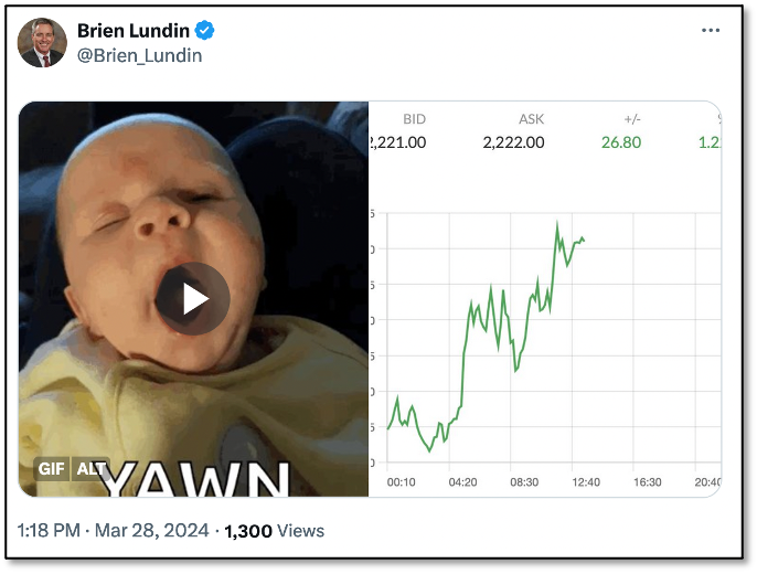 Photo of baby yawning next to gold price chart
