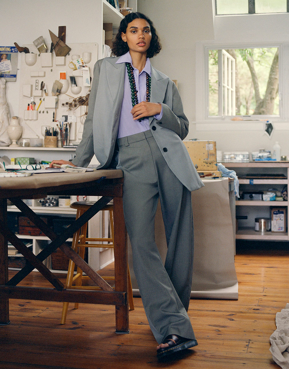 Woman in suit in art studio