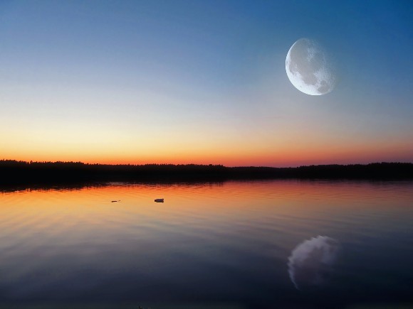 Moon over an evening lake