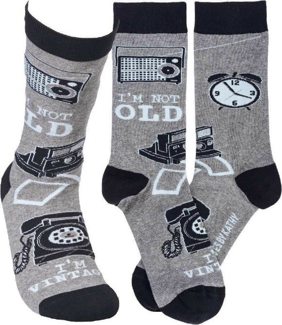 Gray socks with black trim that say "I'm Not Old I'm Vintage"