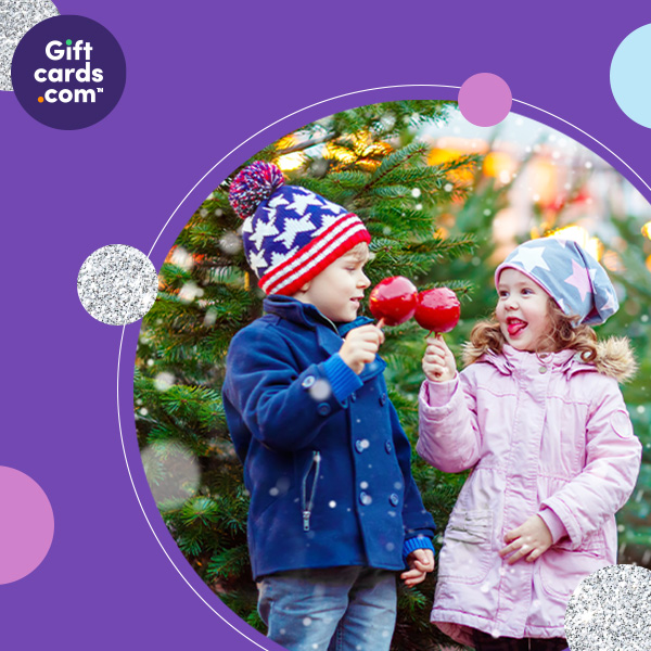 Giftcards.com. Happy children enjoying holiday activities. Shop Gift Cards