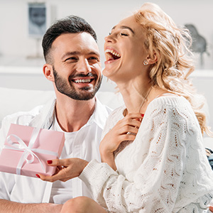 Smiling woman receiving gift