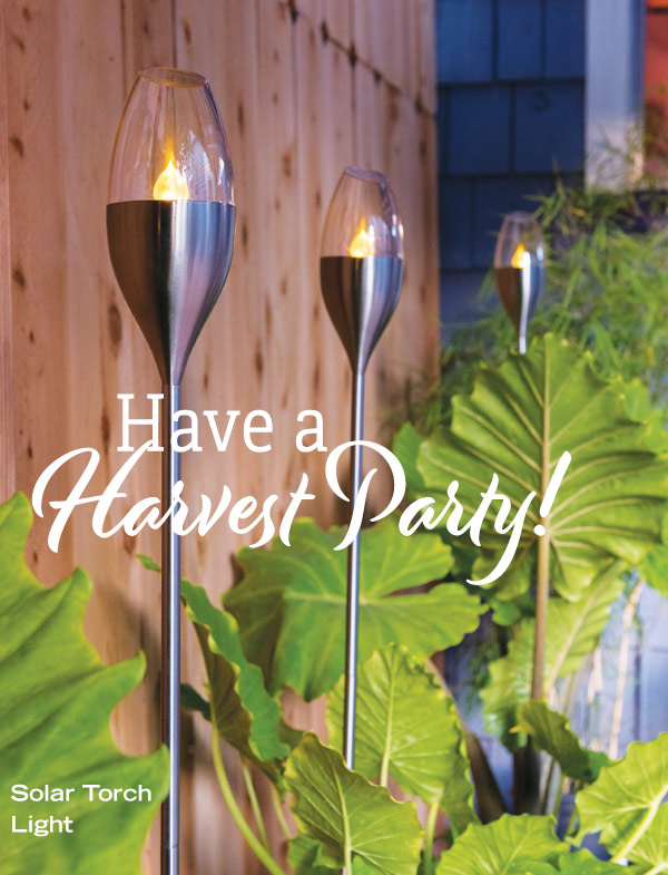 Have a Harvest Party! Pictured: Solar Torch Lights among beautiful green patio foliage.