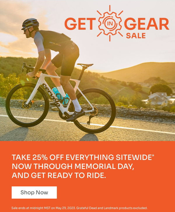 Male cyclist rides at sunset