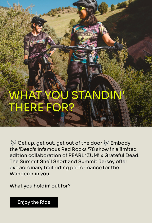 Two mountain bikers in colorful PEARL iZUMi x Grateful Dead MTB kit