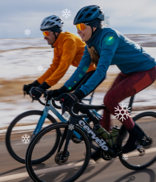 HannahShell and Jake McGee ride against a snowy backdrop