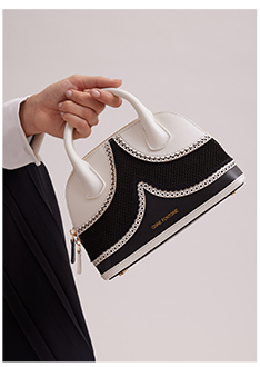 Black and White Leather Handbag With Eyelet Trims