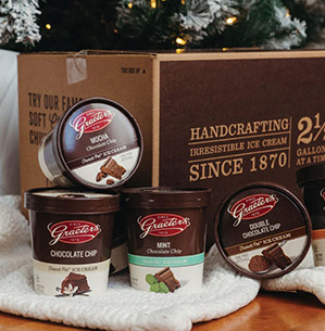 Box of ice cream under a Christmas tree.